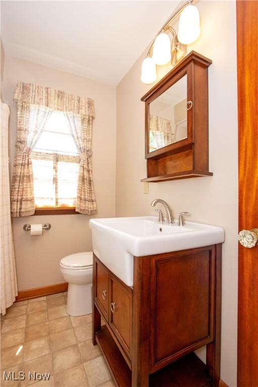 2456 Batdorf Rd, Wooster, OH 44691 - full bathroom featuring vanity and toilet