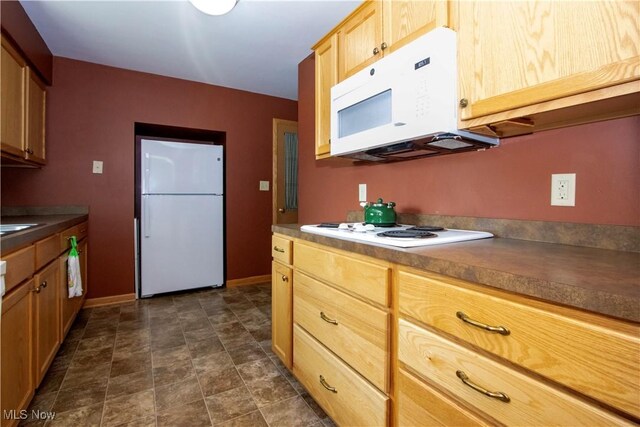 2456 Batdorf Rd, Wooster, OH 44691 - kitchen featuring white appliances, dark countertops, stone finish floors, and light brown cabinets