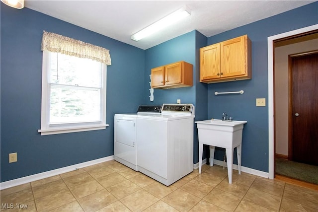 2456 Batdorf Rd, Wooster, OH 44691 - laundry area with cabinet space, washing machine and clothes dryer, and light tile patterned floors