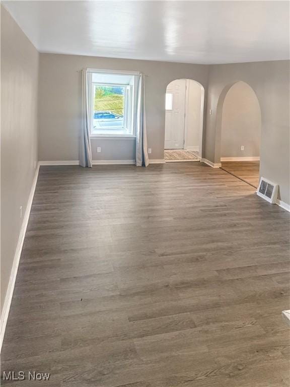 1209 Courtland Rd, Weirton, WV 26062 - empty room with arched walkways and wood finished floors