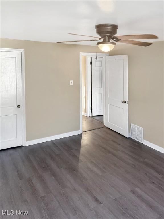1209 Courtland Rd, Weirton, WV 26062 - unfurnished room featuring ceiling fan and dark wood-type flooring