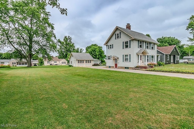 2129 E 41st St, Ashtabula, OH 44004 - back of property with a chimney and a yard