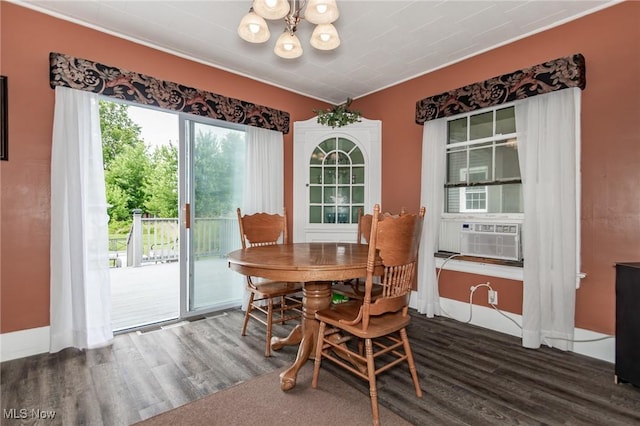 2129 E 41st St, Ashtabula, OH 44004 - dining space with wood finished floors, a chandelier, cooling unit, and ornamental molding