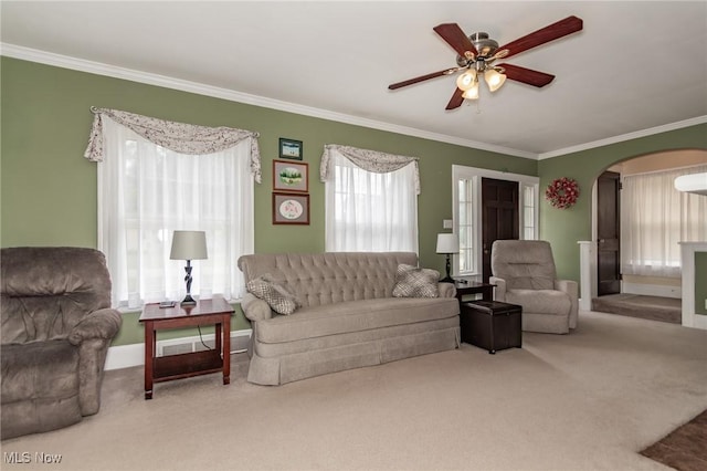 2129 E 41st St, Ashtabula, OH 44004 - carpeted living room featuring arched walkways, healthy amount of natural light, crown molding, and ceiling fan