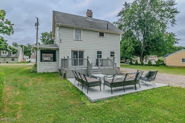 2129 E 41st St, Ashtabula, OH 44004 - rear view of property with a patio, a lawn, a chimney, and outdoor lounge area