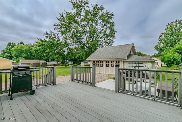 2129 E 41st St, Ashtabula, OH 44004 - deck featuring area for grilling and an outdoor structure