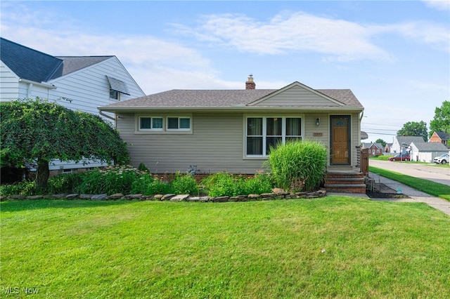 3302 Maplecrest Dr, Parma, OH 44134 - view of front of house with a front yard and a chimney