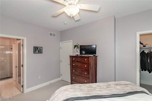 12591 Larchmere Blvd Unit W-6, Cleveland, OH 44120 - bedroom with a closet, ensuite bath, ceiling fan, light colored carpet, and a walk in closet
