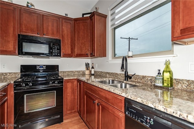 12591 Larchmere Blvd Unit W-6, Cleveland, OH 44120 - kitchen with black appliances, light stone counters, and light wood-type flooring