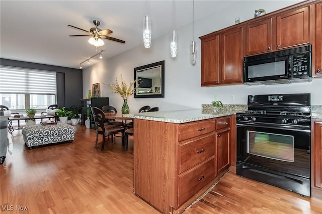 12591 Larchmere Blvd Unit W-6, Cleveland, OH 44120 - kitchen featuring black appliances, a peninsula, ceiling fan, and light wood-style flooring