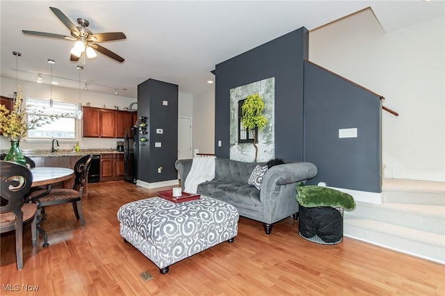 12591 Larchmere Blvd Unit W-6, Cleveland, OH 44120 - living area with light wood-style floors and ceiling fan