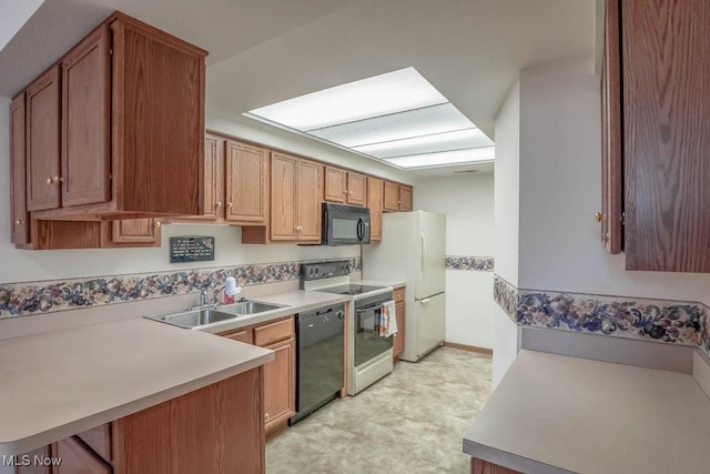 4039 Tannybrooke Ln NW Unit C, Canton, OH 44718 - kitchen featuring black appliances, light countertops, light flooring, and brown cabinets