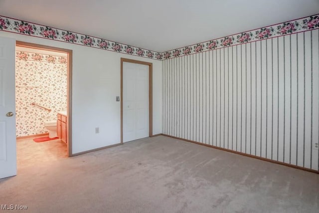 4039 Tannybrooke Ln NW Unit C, Canton, OH 44718 - unfurnished bedroom with carpet, wallpapered walls, and a closet
