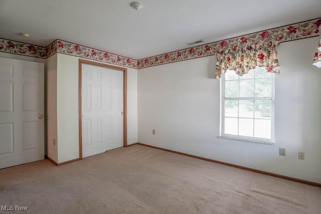 4039 Tannybrooke Ln NW Unit C, Canton, OH 44718 - unfurnished bedroom featuring light carpet, multiple windows, and a closet