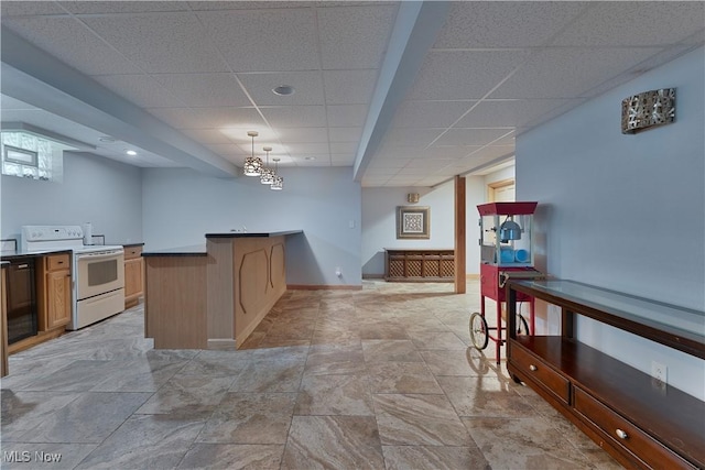 230 Clingan Rd, Struthers, OH 44471 - kitchen featuring electric stove, a paneled ceiling, pendant lighting, a peninsula, and light stone finish flooring