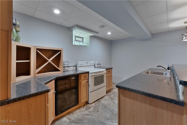 230 Clingan Rd, Struthers, OH 44471 - kitchen with white range with electric stovetop, a drop ceiling, and a peninsula