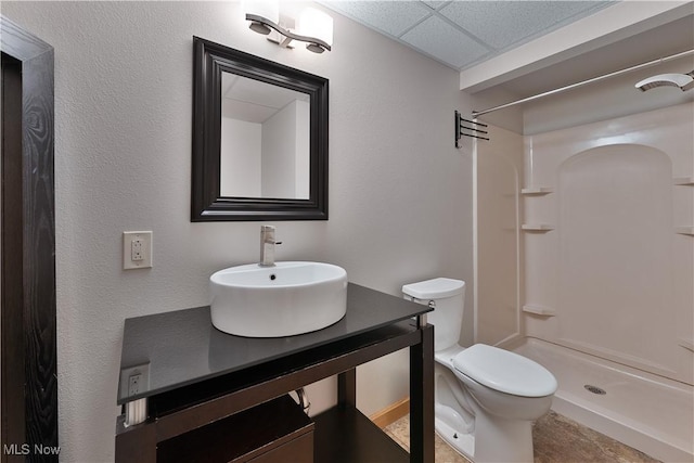 230 Clingan Rd, Struthers, OH 44471 - full bathroom featuring a paneled ceiling, a shower, and vanity