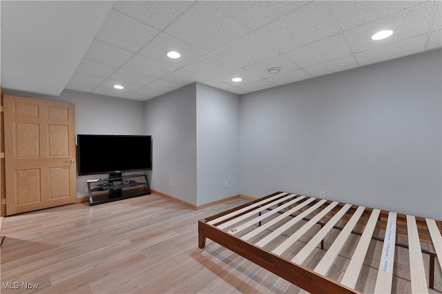 230 Clingan Rd, Struthers, OH 44471 - unfurnished living room with wood finished floors, a paneled ceiling, and recessed lighting