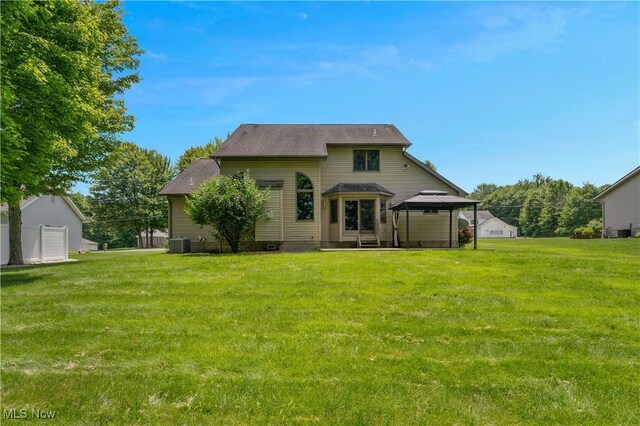 230 Clingan Rd, Struthers, OH 44471 - back of house with a gazebo and a lawn