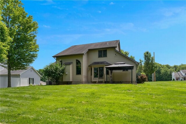 230 Clingan Rd, Struthers, OH 44471 - back of house with a gazebo and a lawn