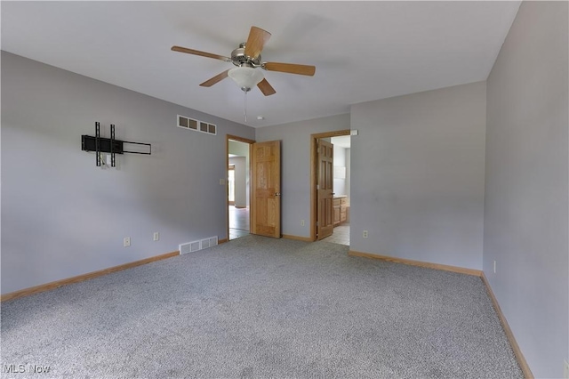 230 Clingan Rd, Struthers, OH 44471 - unfurnished room with ceiling fan and light colored carpet