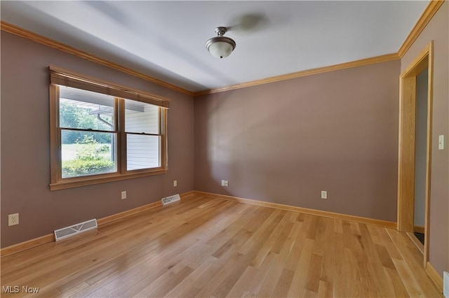 230 Clingan Rd, Struthers, OH 44471 - spare room featuring ornamental molding and light wood-type flooring