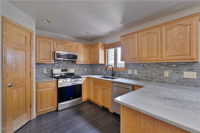 230 Clingan Rd, Struthers, OH 44471 - kitchen with stainless steel appliances, dark tile patterned floors, light countertops, and decorative backsplash
