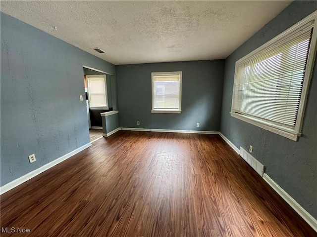 1372 Frederick Blvd, Akron, OH 44320 - unfurnished room with wood finished floors and a textured ceiling