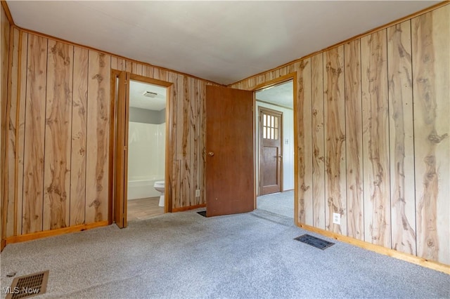 312 28th St SW, Canton, OH 44706 - unfurnished room featuring carpet floors and wood walls