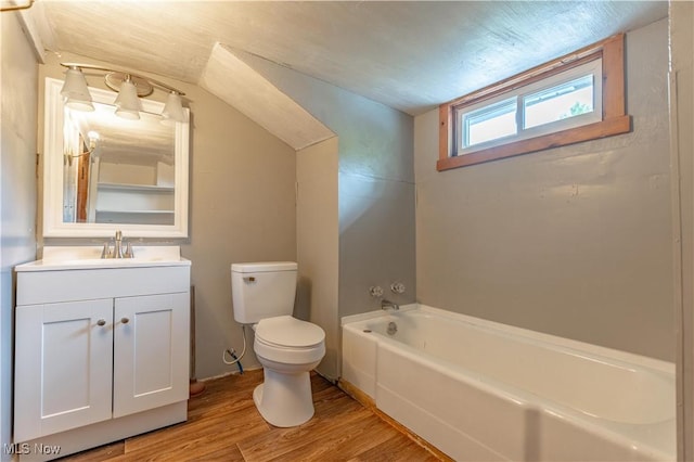 312 28th St SW, Canton, OH 44706 - bathroom with wood finished floors, vanity, and lofted ceiling
