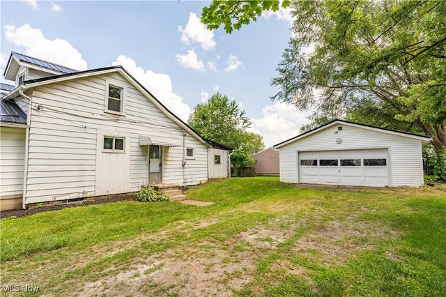 312 28th St SW, Canton, OH 44706 - view of green lawn featuring a detached garage and an outdoor structure
