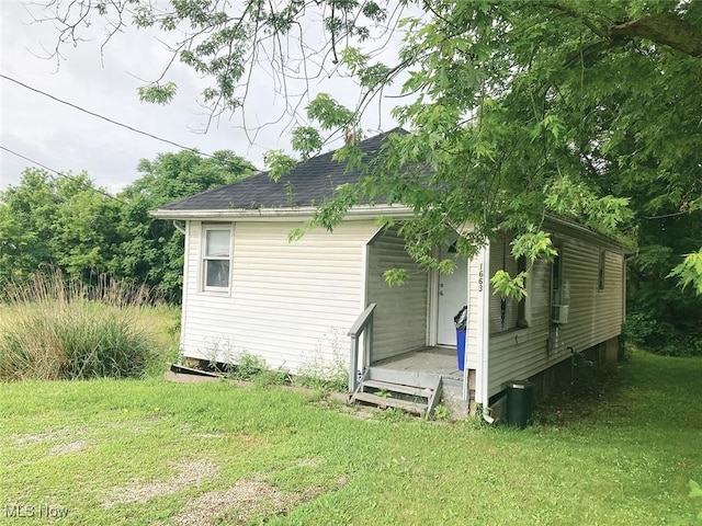 1663 S Lincoln Ave, Salem, OH 44460 - view of home's exterior featuring a lawn and roof with shingles