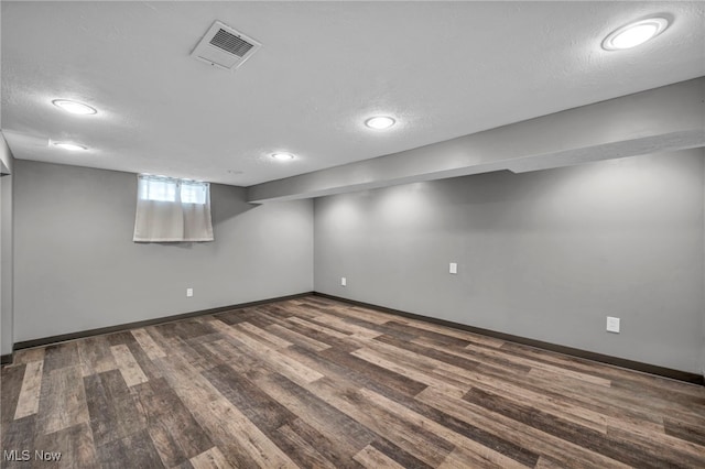 24850 Shoreview Ave, Euclid, OH 44123 - basement featuring wood finished floors, recessed lighting, and a textured ceiling