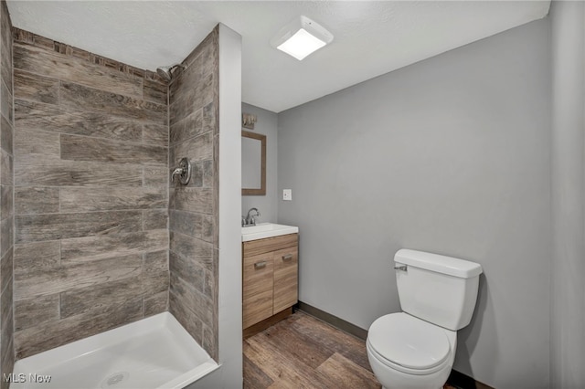24850 Shoreview Ave, Euclid, OH 44123 - bathroom with wood finished floors, vanity, and tiled shower