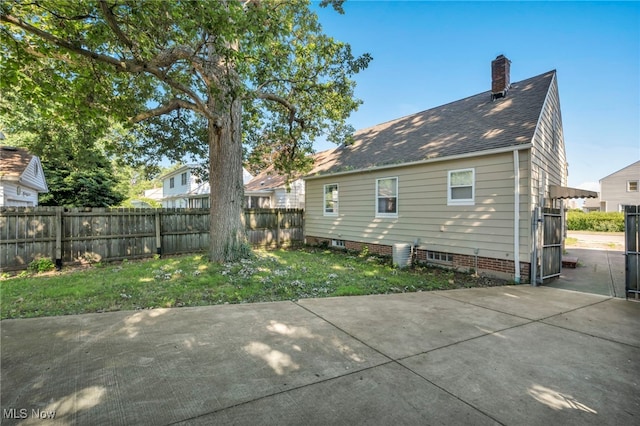 24850 Shoreview Ave, Euclid, OH 44123 - back of property featuring a patio and a chimney