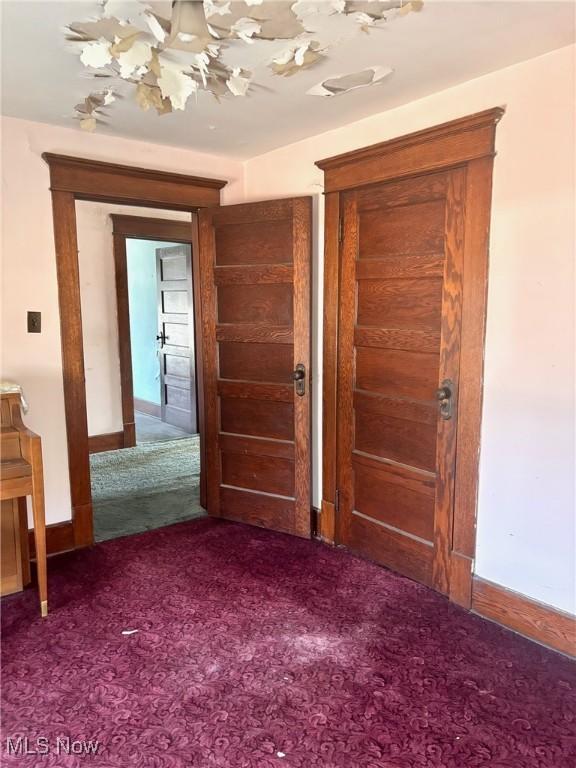 8 E Main St, New Concord, OH 43762 - corridor with carpet flooring and baseboards