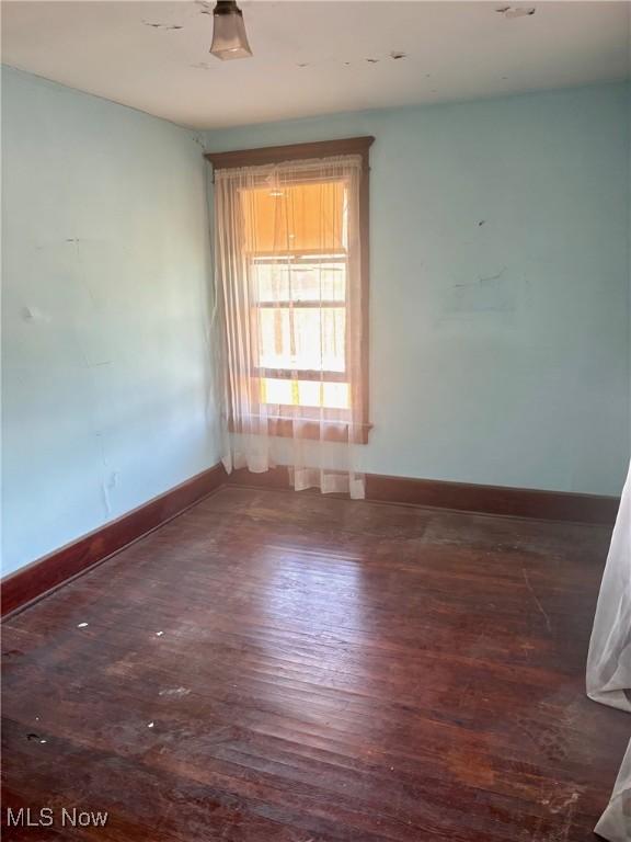8 E Main St, New Concord, OH 43762 - empty room featuring wood finished floors and baseboards