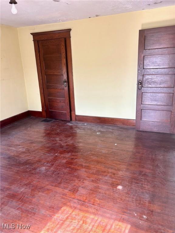 8 E Main St, New Concord, OH 43762 - empty room featuring wood finished floors