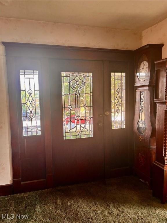 8 E Main St, New Concord, OH 43762 - entrance foyer featuring healthy amount of natural light and carpet