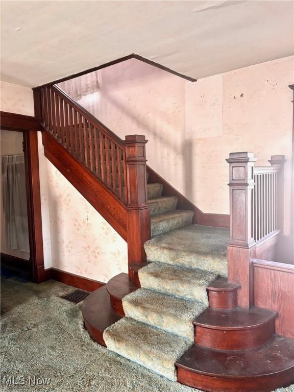 8 E Main St, New Concord, OH 43762 - stairway featuring carpet and baseboards