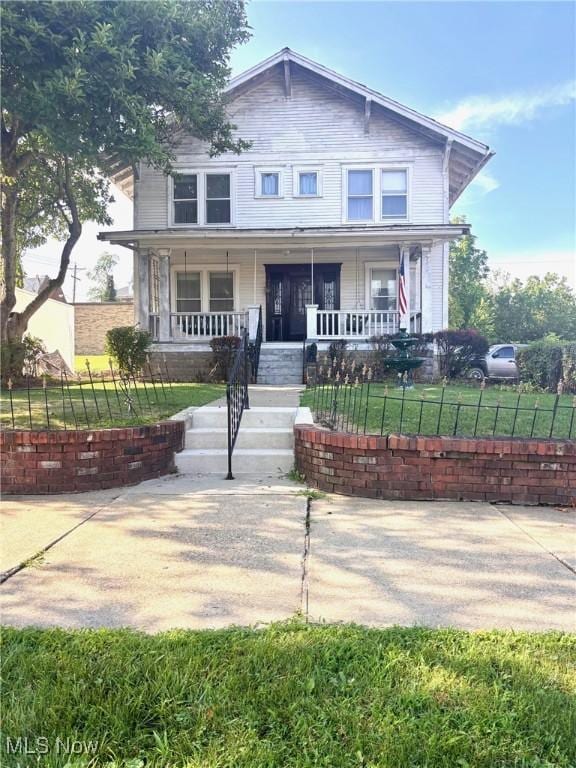8 E Main St, New Concord, OH 43762 - view of front of house featuring a porch