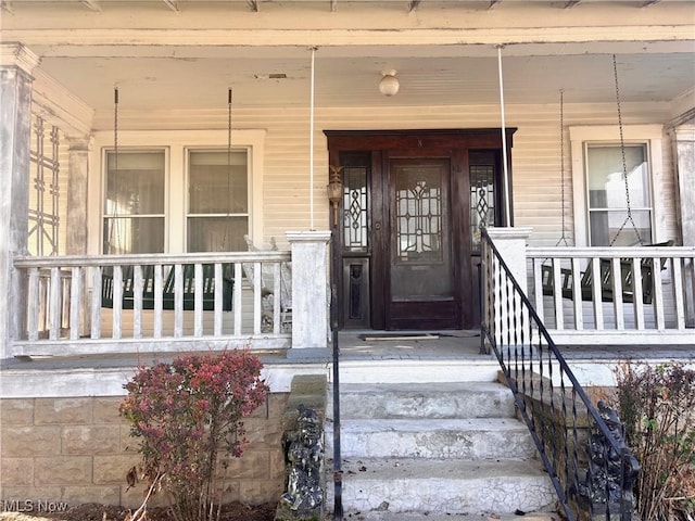 8 E Main St, New Concord, OH 43762 - property entrance featuring a porch