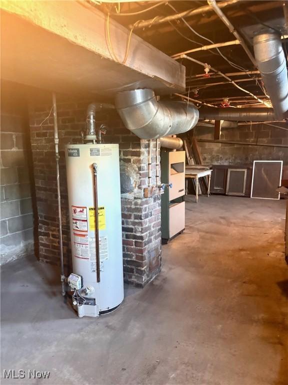 8 E Main St, New Concord, OH 43762 - unfinished below grade area with gas water heater and concrete block wall