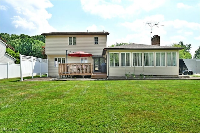 8518 Four Seasons Trl, Poland, OH 44514 - back of property with a wooden deck, a chimney, and a sunroom