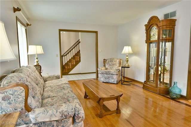 8518 Four Seasons Trl, Poland, OH 44514 - living area featuring wood finished floors and stairs