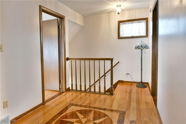 8518 Four Seasons Trl, Poland, OH 44514 - corridor featuring an upstairs landing and wood finished floors
