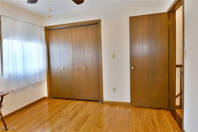 8518 Four Seasons Trl, Poland, OH 44514 - unfurnished bedroom with light wood-style flooring, a closet, and ceiling fan