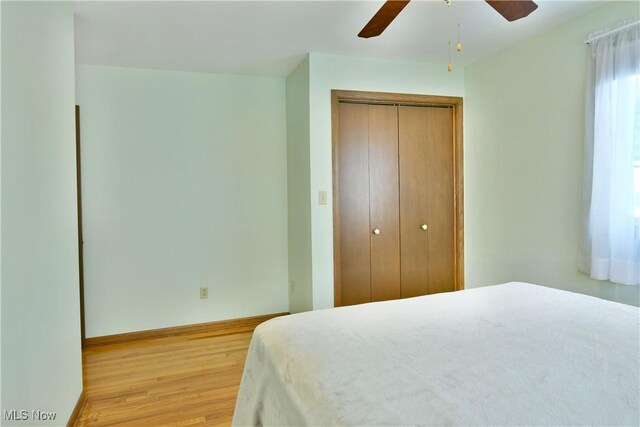 8518 Four Seasons Trl, Poland, OH 44514 - bedroom featuring light wood-style flooring, a closet, and ceiling fan