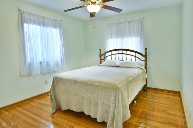 8518 Four Seasons Trl, Poland, OH 44514 - bedroom with wood finished floors and ceiling fan
