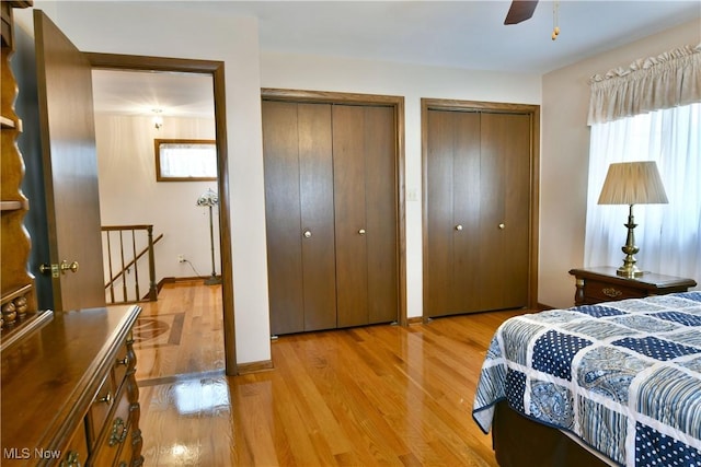 8518 Four Seasons Trl, Poland, OH 44514 - bedroom with two closets, multiple windows, and light wood-style flooring